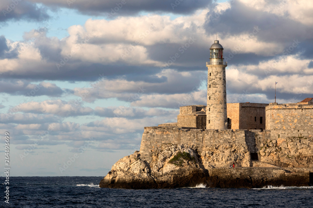 Lighthouse and Fortress built by the Spanish at the entrace to the port, Havana Cuba view from malecon