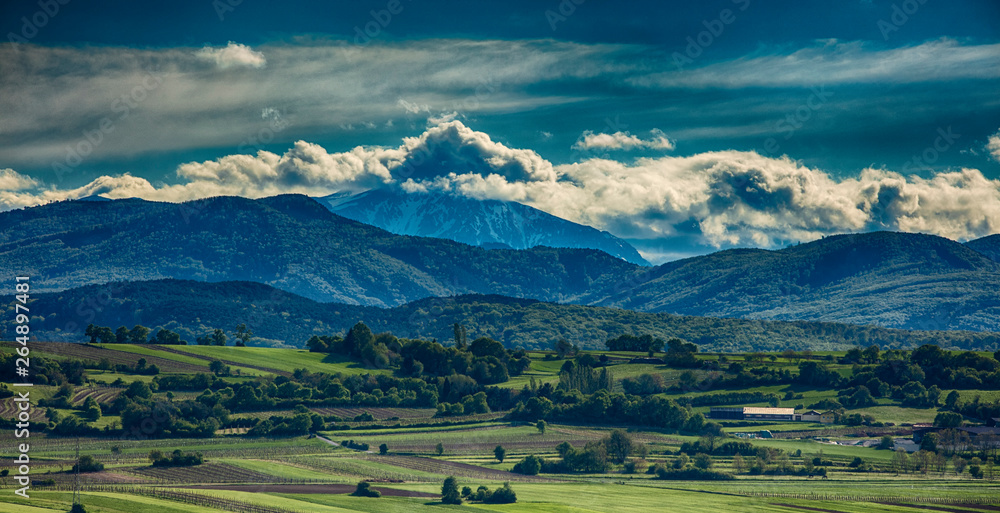 green valley and mountains landscape 