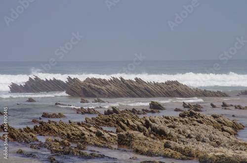 Cliffs on Praia da Fateixa. Arrifana Atlantic sea coast in Algarve, the south of Portugal.