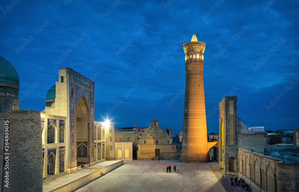 Poi Kalan at dusk - an islamic religious complex located around the Kalan minaret in Bukhara, Uzbekistan
