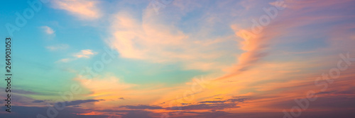 Panoramic beautiful colorful golden hour twilight sky. Beautiful cloud and sky nature background in magic hour. Amazing colorful sky and dramatic sunset evening sky. © ezstudiophoto