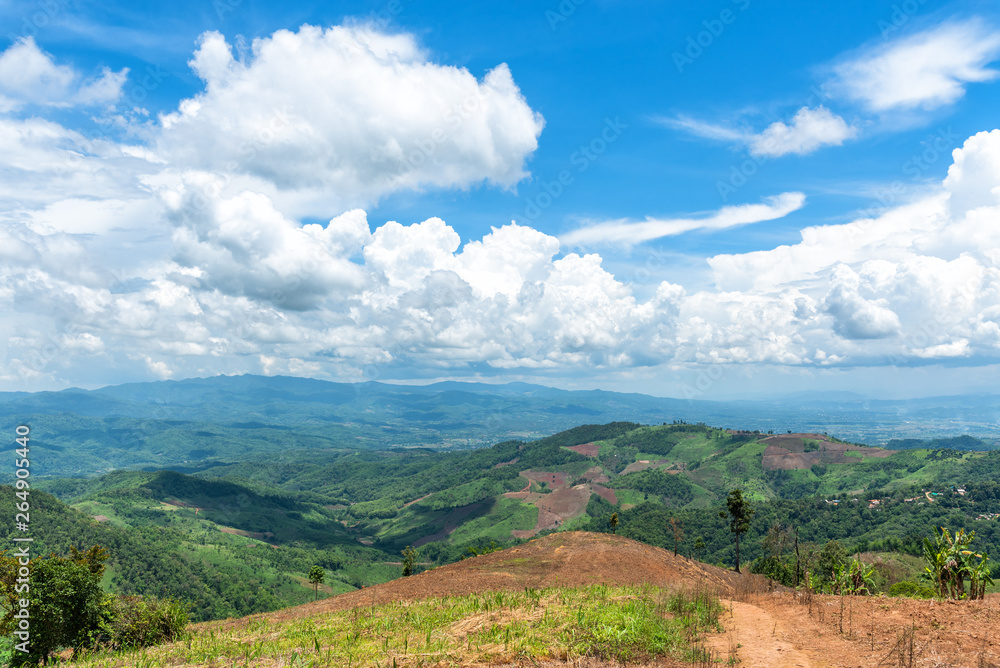 Mountain forest valley and cloud blue sky. Doi chang in Chiang Rai, Thailand.
