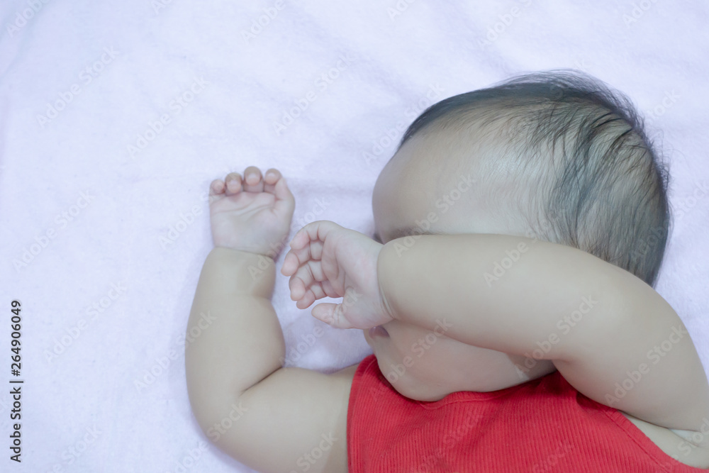 Sleeping Asian baby girl in pink background Stock Photo | Adobe Stock