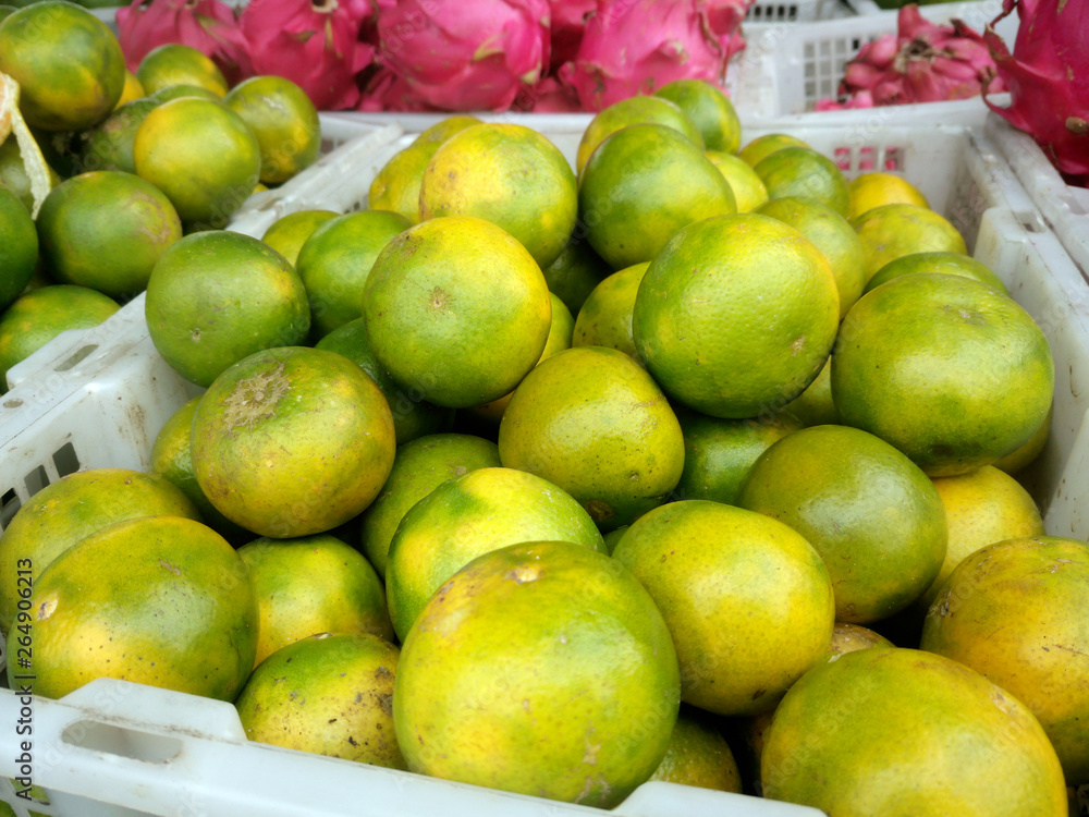 fresh orange fruit in a basket on the market