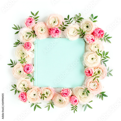 Floral pattern frame made of pink ranunculus and roses flower buds on white background with space for text. Flat lay, top view floral background.