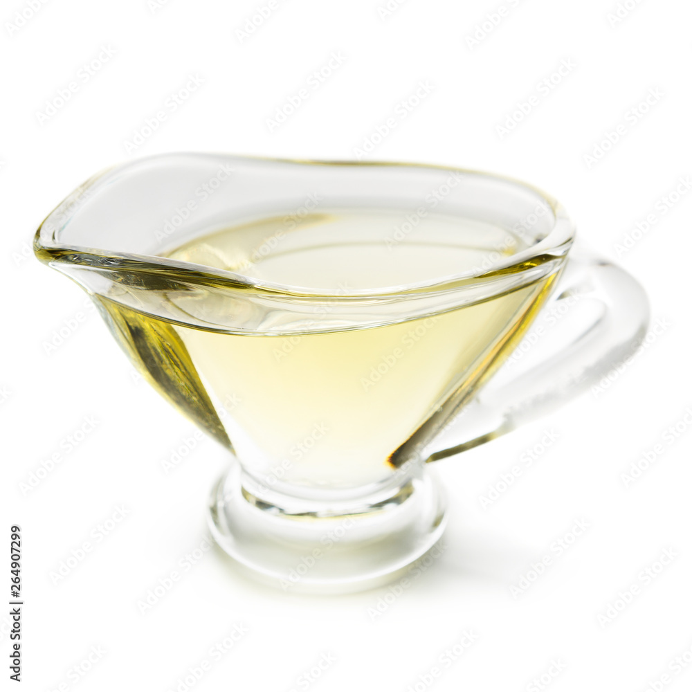 Olive oil in glass jar on white Olive oil in glass jar on white
