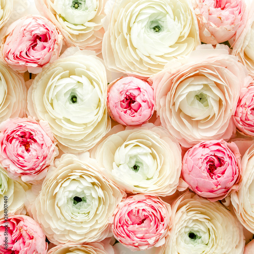 Bouquet, texture of pink ranunculus and rose flower buds close up. Flat lay, top view. Ranunculus flower texture. 