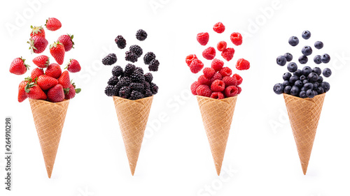 In the foreground, lively variety of berries in ice cream cones, isolated from the white background