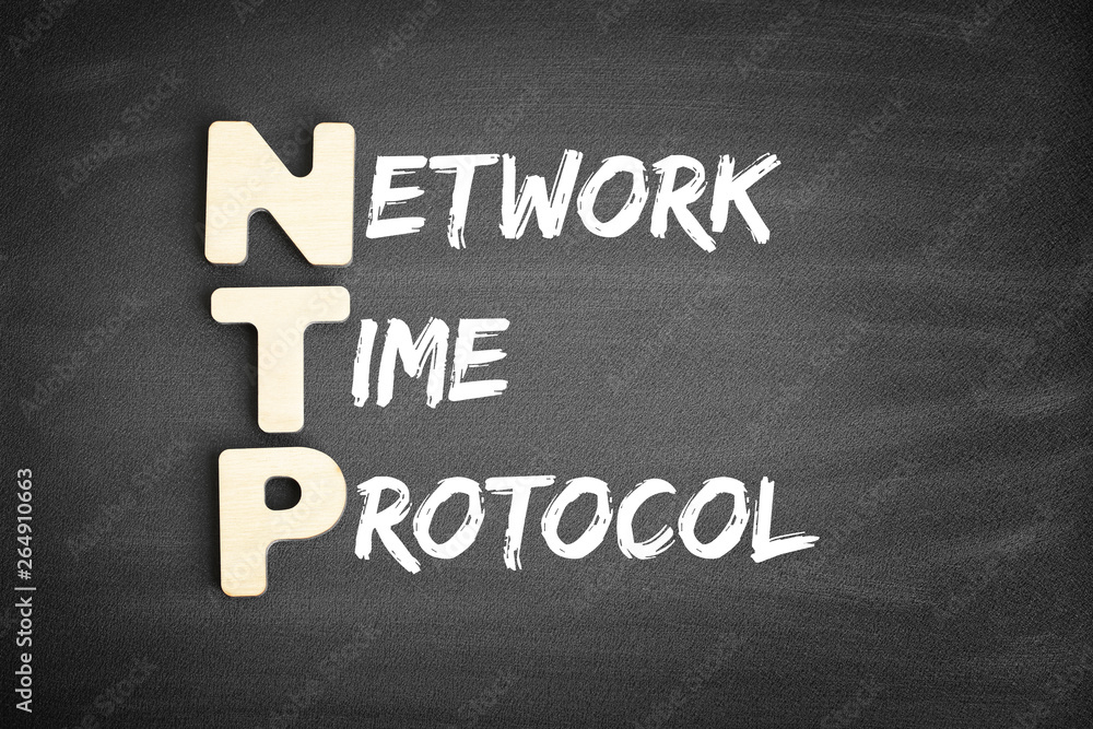 Fototapeta premium Wooden alphabets building the word NTP - Network Time Protocol acronym on blackboard