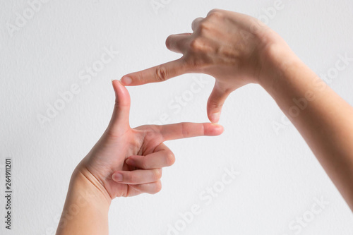 symbol of camera frame by using thumb and forefinger of two hands.