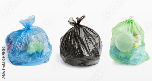 Three full garbage bags in row