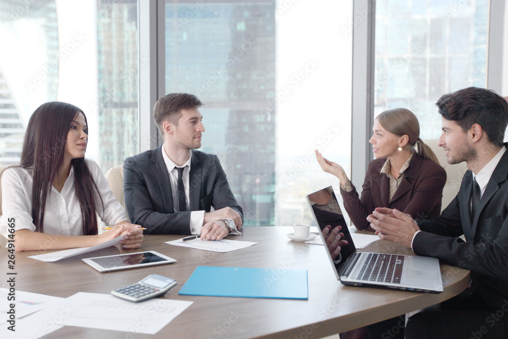 Business people working together at a meeting Business people working together at a meeting