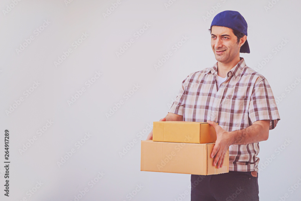 Asian young man holding box package, delivery man