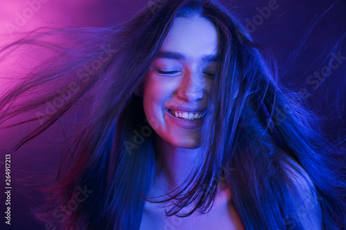 Woman Colorful Portrait. Girl playing with hair