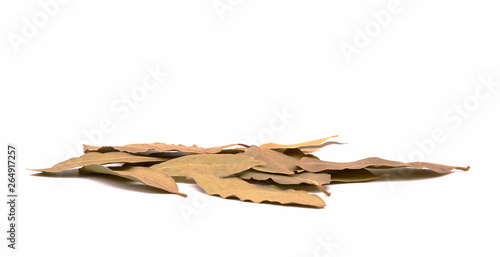 Close-up view of a pile of bay leaves. Spices isolated on white background.