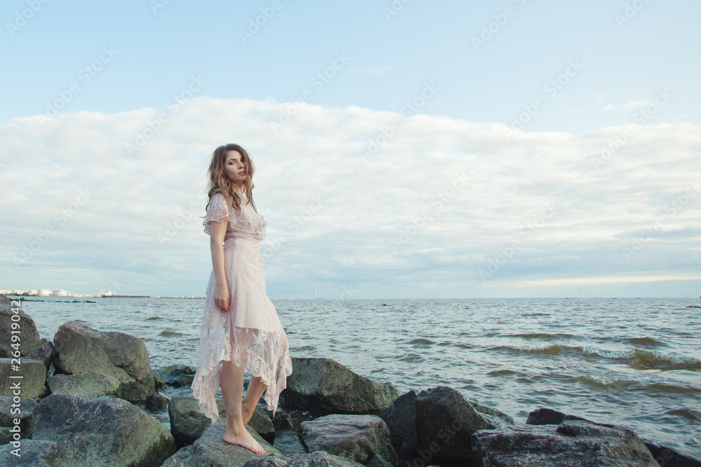 Portrait of stylish woman on ocean coast, romantic beauty Portrait of stylish woman on ocean coast, romantic beauty
