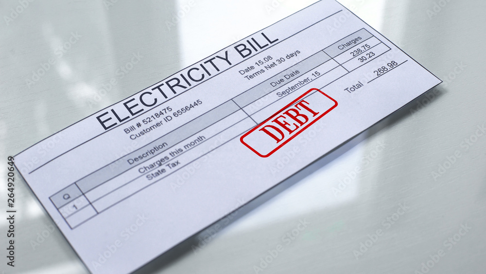 Fototapeta premium Debt seal stamped on electricity bill, payment for services, month expenses