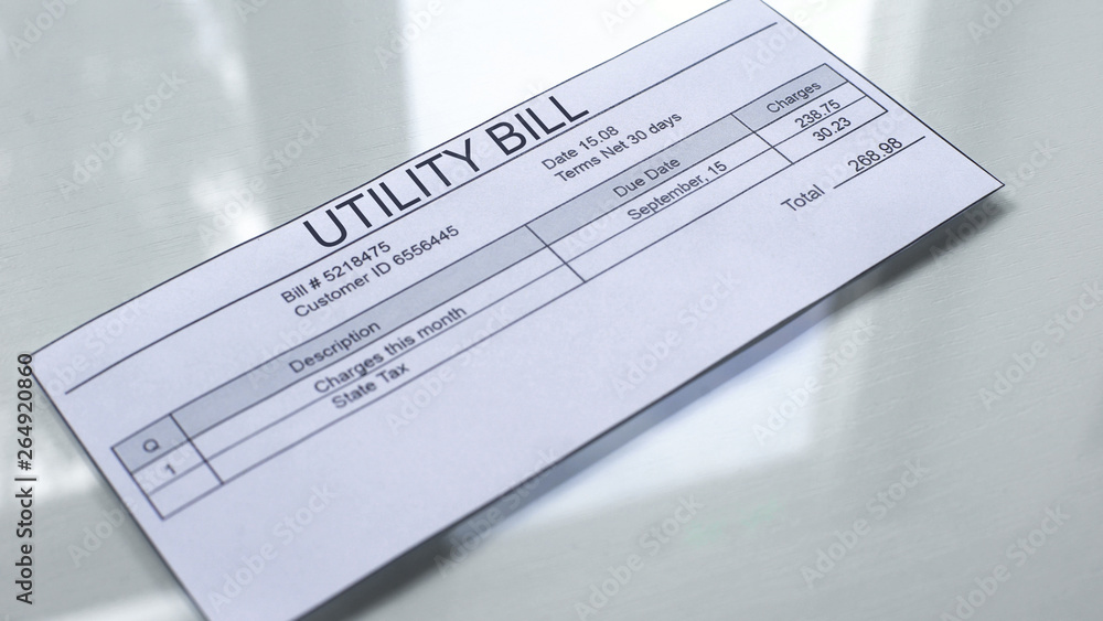 Utility bill lying on table, payment for services, month expenses, tariff Utility bill lying on table, payment for services, month expenses, tariff