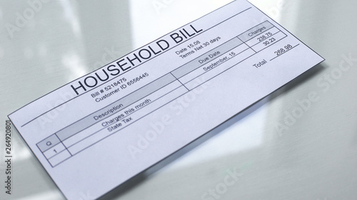 Household bill lying on table, payment for services, month expenses, tariff