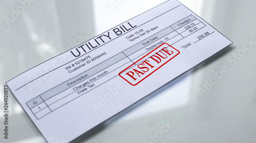 Utility bill past due, seal stamped on document, payment for services, charges