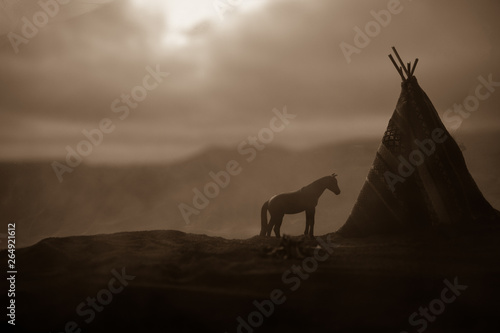 An old native american teepee in the desert photo