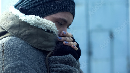 Картината върху платно Poor woman in dirty clothes feeling cold, homeless lifestyle, hopelessness