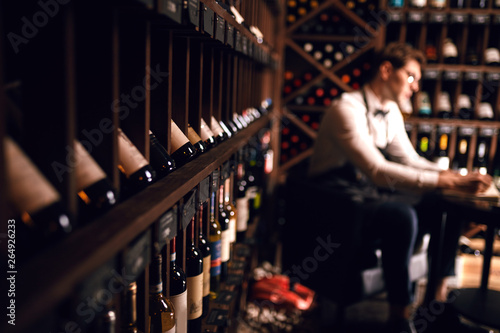 Professional sales personnel - sommelier will help choose right product just for clients. In Wine Boutique customers welcome to taste product that they have chosen. Winemaking. Occupations photo