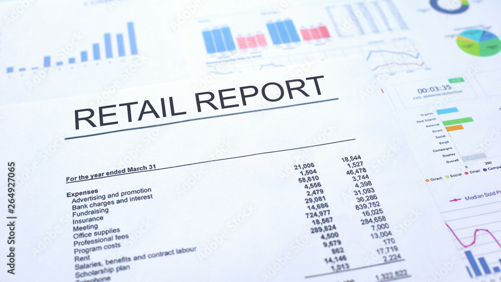 Retail report lying on table, graphs charts and diagrams, official document Retail report lying on table, graphs charts and diagrams, official document