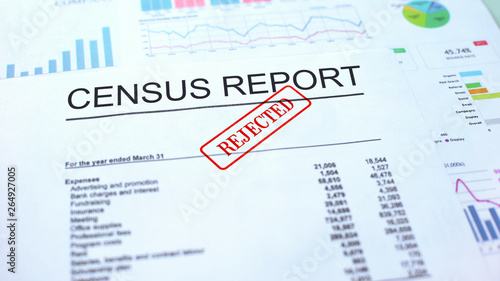 Census report rejected, hand stamping seal on official document, statistics