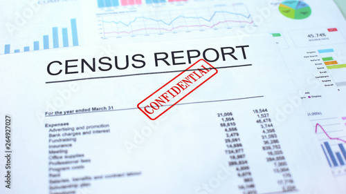 Census report confidential, hand stamping seal on official document, statistics