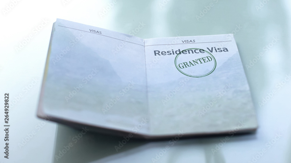 Residence visa granted, seal stamped in passport, customs office, travelling Residence visa granted, seal stamped in passport, customs office, travelling