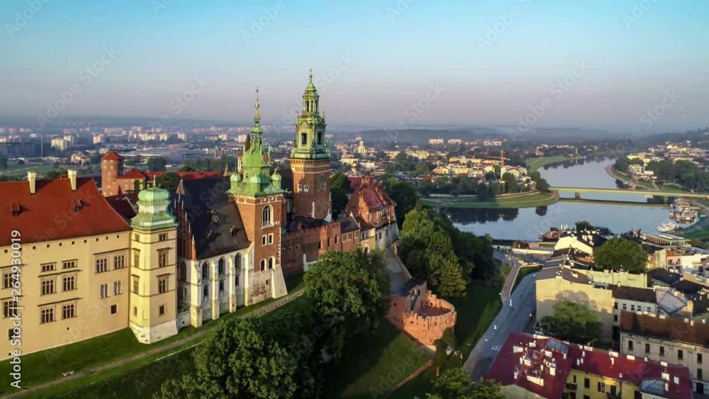 Krakow, Poland. Wawel Gothic Cathedral and belfry with the famous Sigismund Bell (Dzwon Zygmunta), renaissance castle and Vistula river in the background. Aerial 4K flyby video in sunrise light Krakow, Poland. Wawel Gothic Cathedral and belfry with the famous Sigismund Bell (Dzwon Zygmunta), renaissance castle and Vistula river in the background. Aerial 4K flyby video in sunrise light