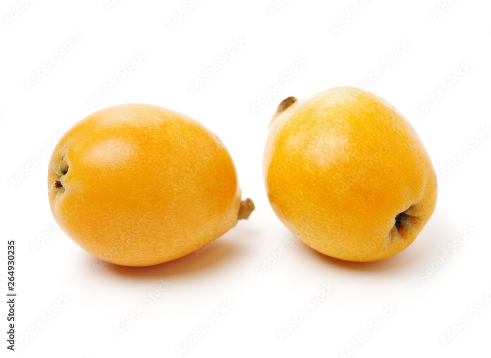 Close up view of some loquat fruit isolated on a white background Close up view of some loquat fruit isolated on a white background