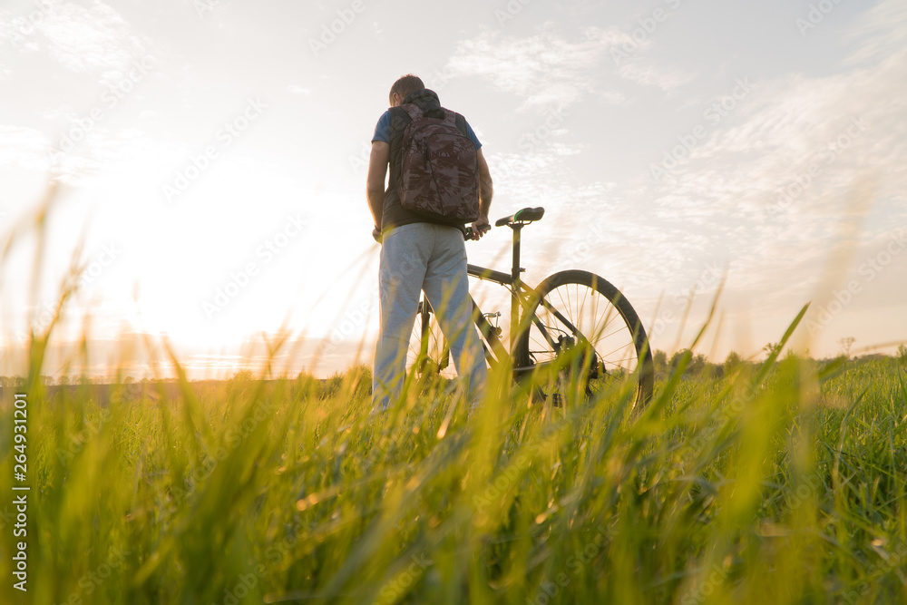 man on bike. sunset bike. bike at sunset. man on bike. sunset bike. bike at sunset.