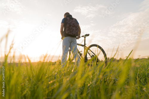man on bike. sunset bike. bike at sunset.