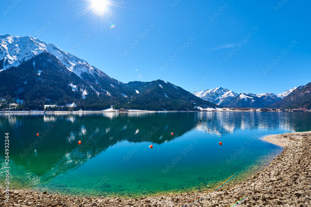 Naklejka premium Beautiful landscape of lake Achen on a sunny day in the Austrian Alps. Photo taken in Spring.
