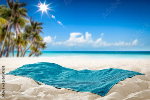 Fototapeta Naklejka Na Ścianę i Meble -  Summer towel on sand and beach background. 