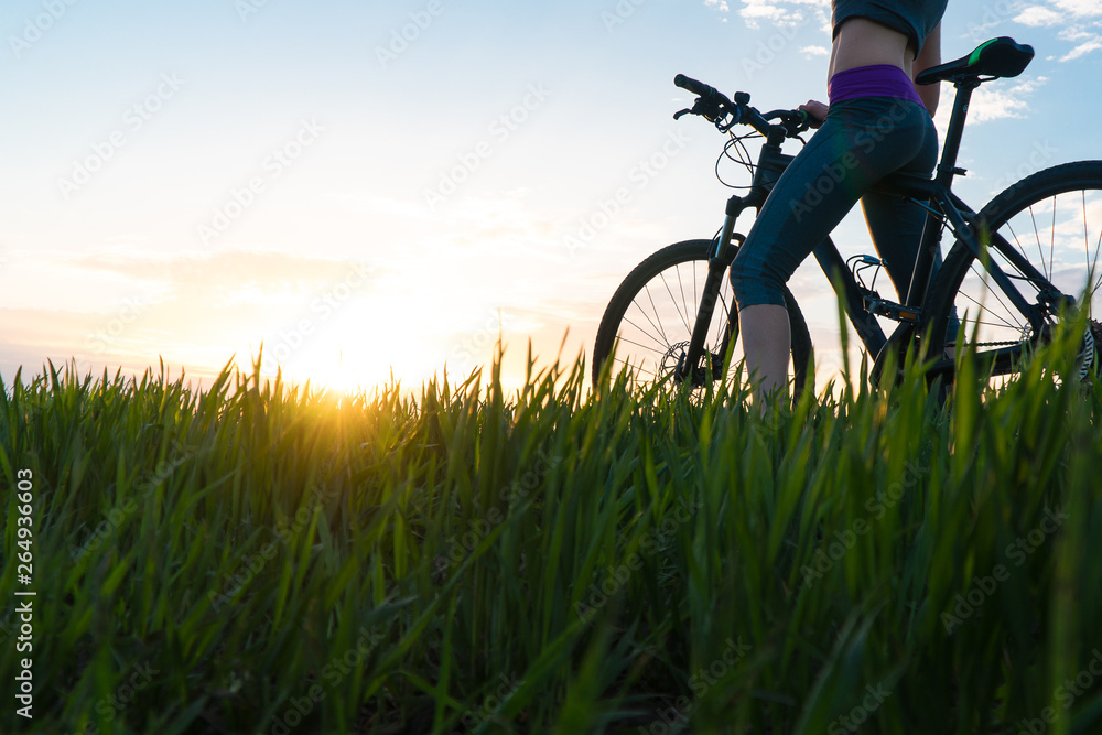 woman bike sunset. exercise at sunset. woman bike sunset. exercise at sunset.