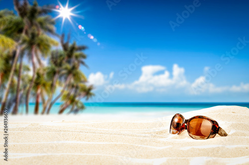 Fototapeta Naklejka Na Ścianę i Meble -  Summer sunglasses on beach and free space for your decoration. 