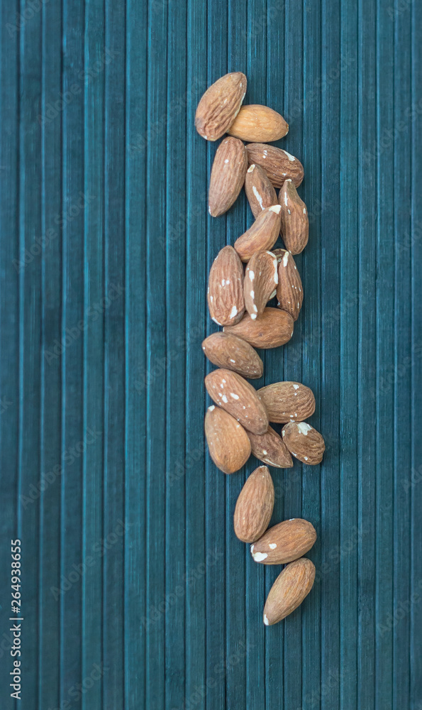 Fototapeta premium Healthy food for background image close up almond nuts. Texture Nuts on top view mock up