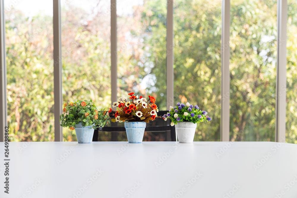 Grop of bouquet colorful artificial flower in vase on modern table Grop of bouquet colorful artificial flower in vase on modern table