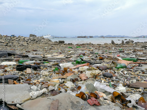 Destruction pollution environment garbage on the beach and the sea