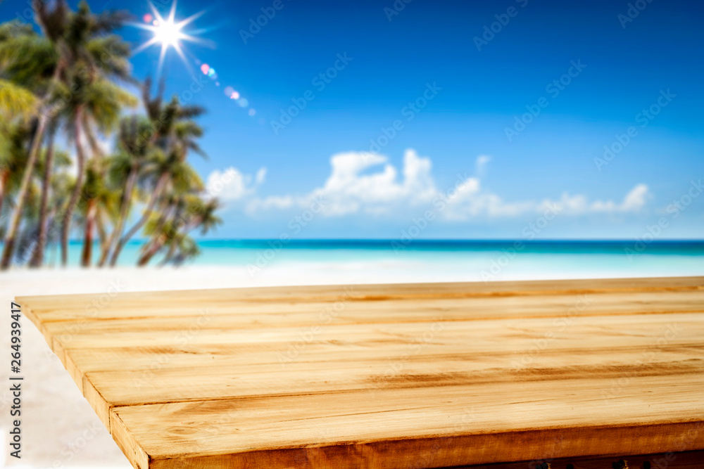 Fototapeta premium Summer table background of free space for your decoration and landscape of beach with palms.
