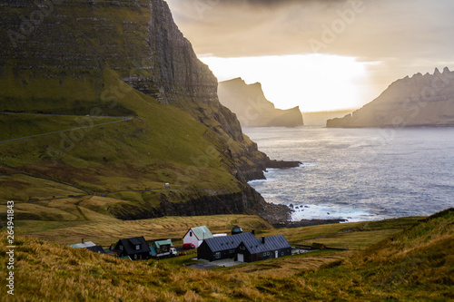 View of Gasadalur village in Vegas Island,Faroe Islands.Beautiful traditional village on coast under mountains with typical nordic Scandinavian houses.Tourist popular attraction/destination in Denmark © Dajahof