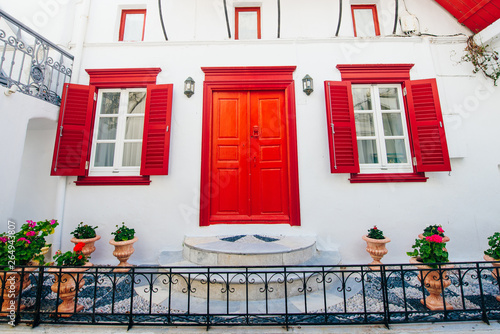 Photos front of house with red windows on island mykonos in greece