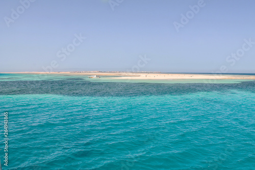 Paradise Islands with turquoise water and mountains.