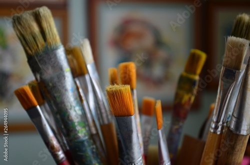 artistic brushes of different shapes and numbers on the background of paintings