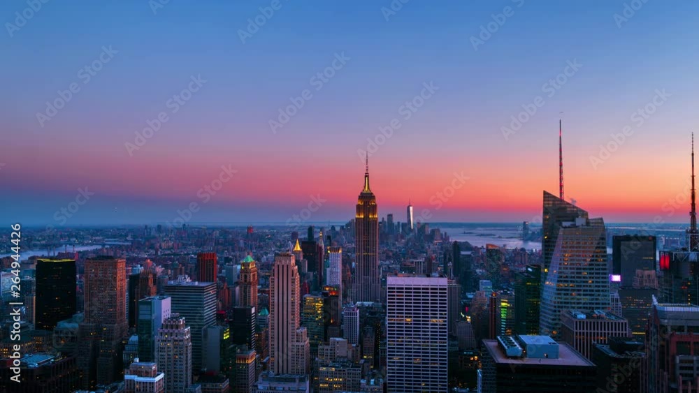 New York, USA. Aerial view on the city skyline in New York City, USA, on a warm sunny summer evening with clear sky. Time-lapse of skyscrapers at sunset