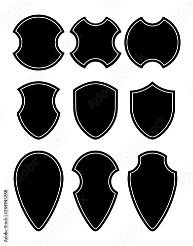 Shield silhouettes for signs and symbols (safety, security, military, medieval). Vector illustration. photo