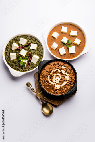 Palak paneer butter masala, yellow dal or dal-makhani served in a bowl in a group. selective focus photo